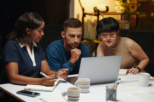 A diverse group of Mexican entrepreneurs collaborating on a laptop, reviewing tax information together in a modern co-working space, symbolizing knowledge sharing and adaptation to new fiscal regulations.
