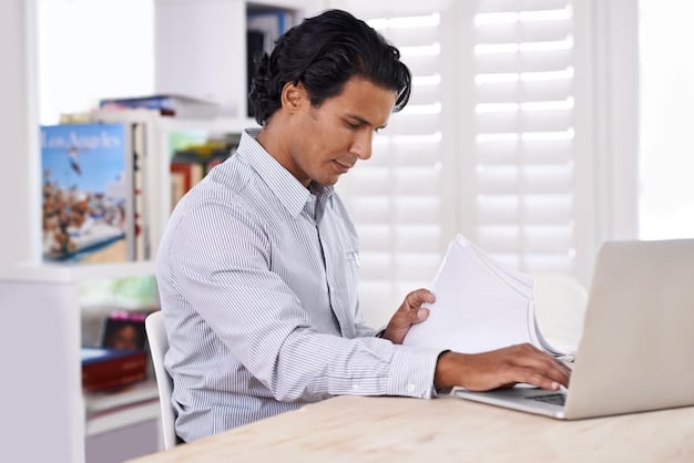 A Mexican accountant sitting at a desk with a laptop, reviewing documents related to IMSS and SAT registrations, highlighting the complexities of fiscal responsibilities.