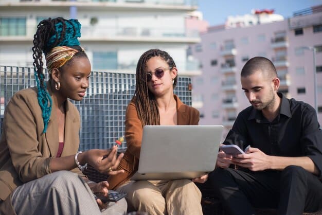 A diverse group of people in Mexico City collaborating on a digital marketing project. They are gathered around a table with laptops and tablets, brainstorming ideas for creating online content, showcasing teamwork and innovation.