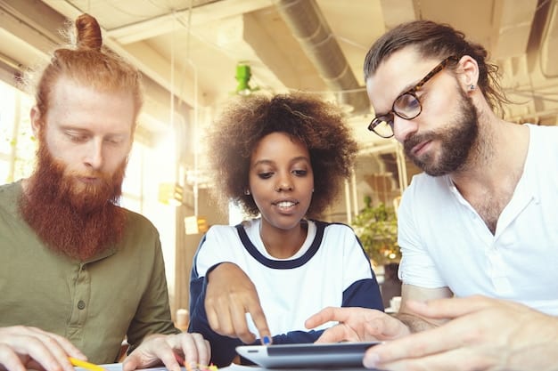 A close-up photograph of a team of Softtek employees strategizing around a table, highlighting collaboration and innovative thinking. Diverse individuals are shown engaged in a discussion, with laptops and tablets displaying data analytics and digital solutions.