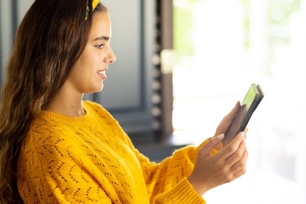A close-up of a person using the Banorte mobile banking app on a smartphone, showing a user-friendly interface with financial charts and transaction details.